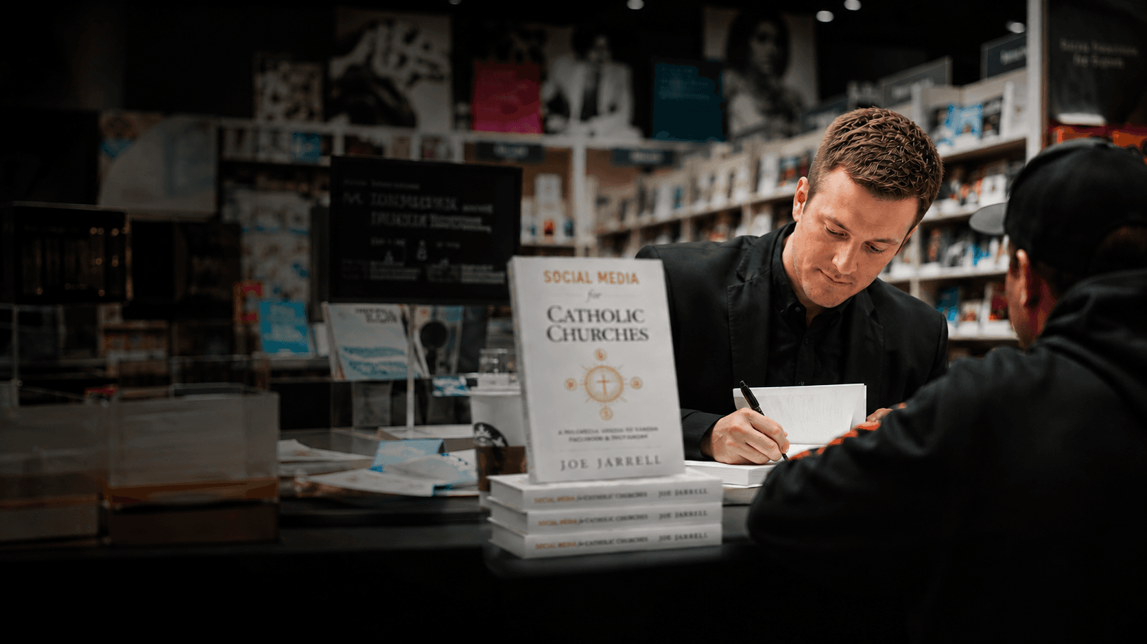 Joe Jarrell signing copies of Social Media for Catholic Churches