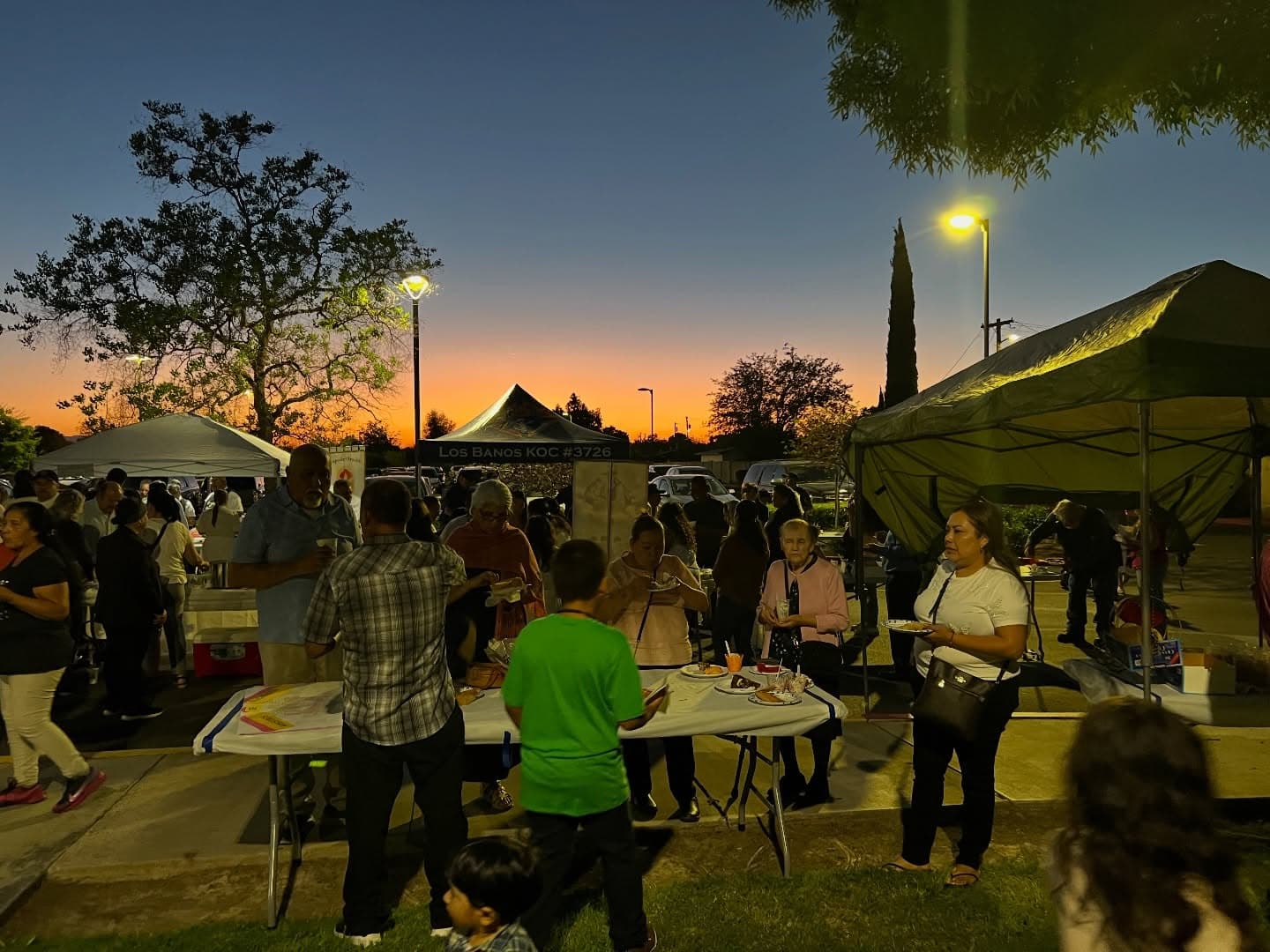 Families gathered at the food tents at dusk during last year's festival