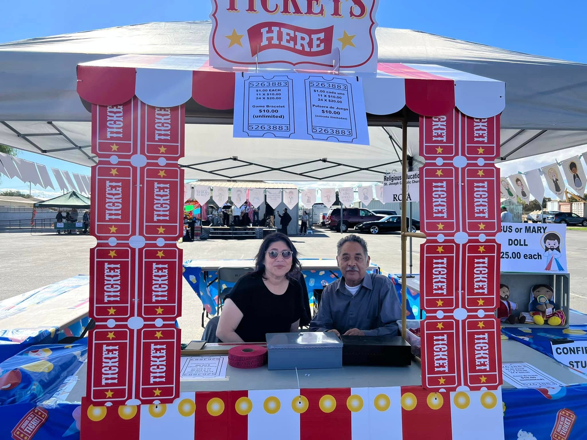 Volunteers selling raffle tickets at the festival ticket booth